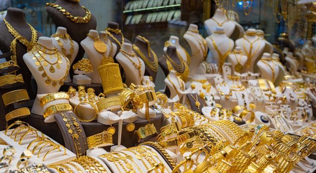 Various gold jewelry on a shop window in Turkey