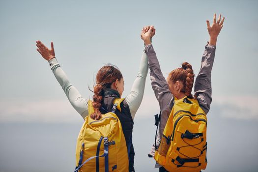 Women outdoor travel, celebrate success adventure and hiking support achievement on mountain top. Blue sky landscape, best friends love nature, sunshine at peak and calm freedom of girl sisters trip