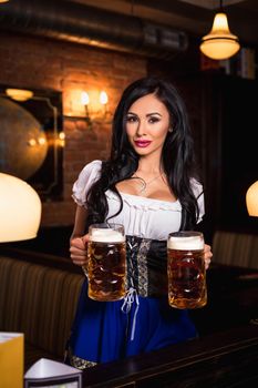 Young waitress brings beer to visitors