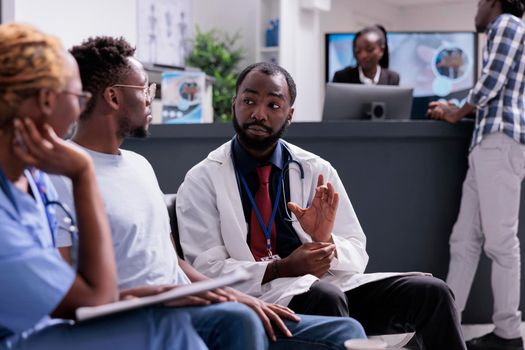 African american medical team consulting man