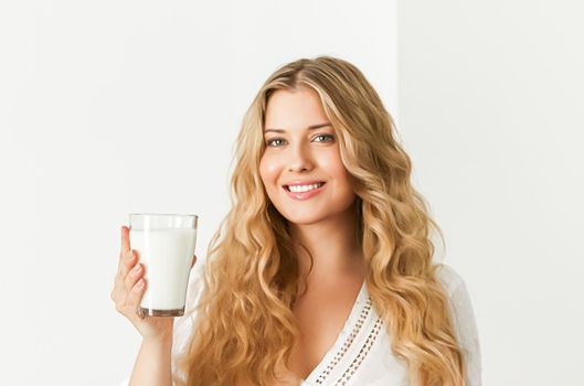 Diet, health and wellness, woman holding glass of milk or protein shake cocktail