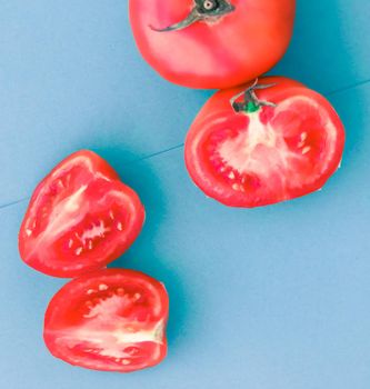 Fresh ripe red tomatoes on blue background, organic vegetable food