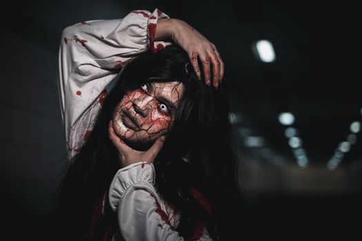 Horror bloodthirsty woman ghost or zombie she is horror scary with breaks her neck