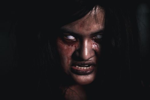 Horror bloodthirsty woman ghost or zombie she is horror scary with open mouth