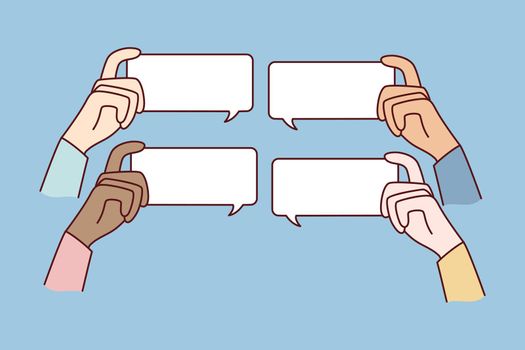 Diverse people hands holding mockup message bubbles with comments online. Users comment on internet. Talk balloons with empty copy space. Feedback and notification.