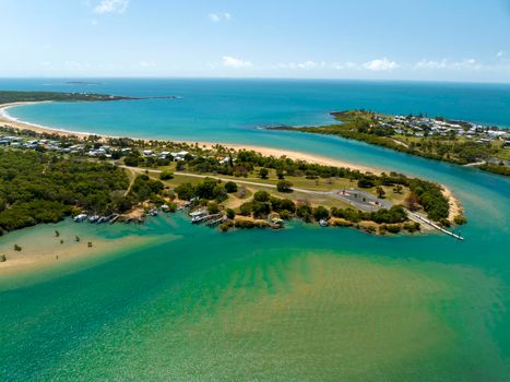An Australian suburb by the sea with water and mangroves.