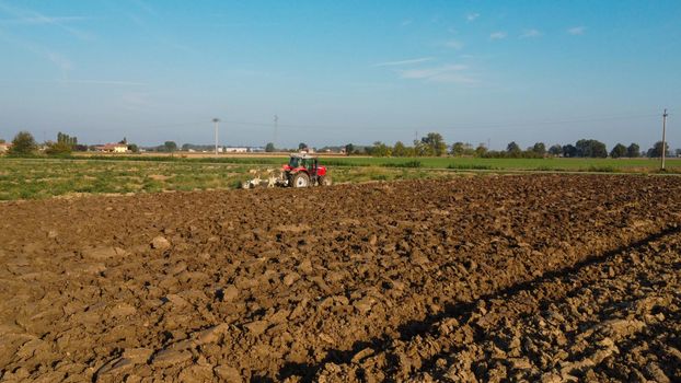 Monitcelli, Italy PC - September 2022 Tractor plowing the land in the fields