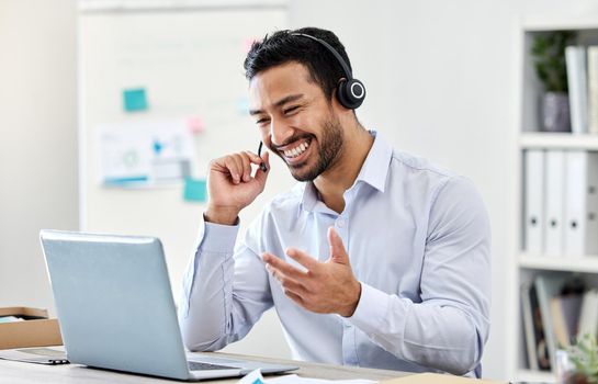 Asian man, laptop or call center worker in communication, customer service or contact us support office. Smile, happy and excited crm consultant or telemarketing receptionist on tech sales consulting