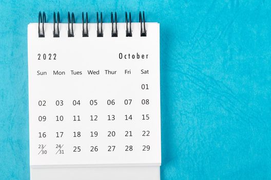 The December 2022 Monthly desk calendar for 2022 year on blue background.