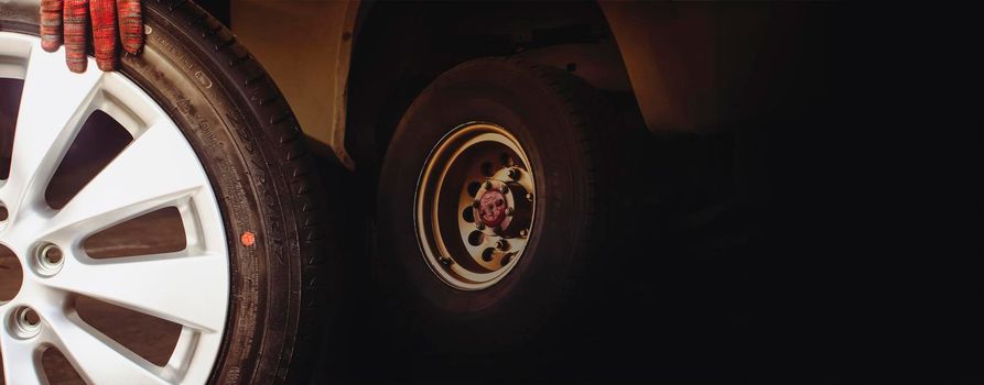 Car wheel and automobile repairing double exposure on black background with copy space