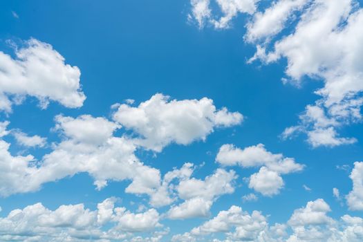 Beautiful blue sky and white cumulus clouds abstract background. Cloudscape background. Blue sky and fluffy white clouds on sunny day. Nice weather. Beauty cumulus cloudscape. Summer sky weather.
