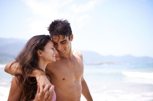 Love is in the air. a young couple enjoying a beach getaway.