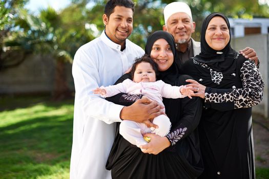 Three generations of love. A muslim family enjoying a day outside.