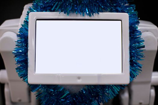 Blank electronic display in Christmas tinsel.Blank electronic display