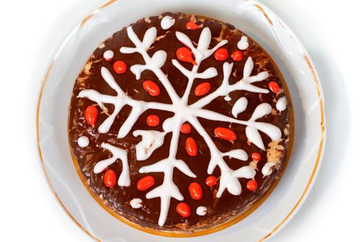 Christmas cake with decorative snowflake on a white background.