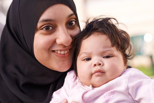 Moms little love. a muslim mother and her little baby girl.