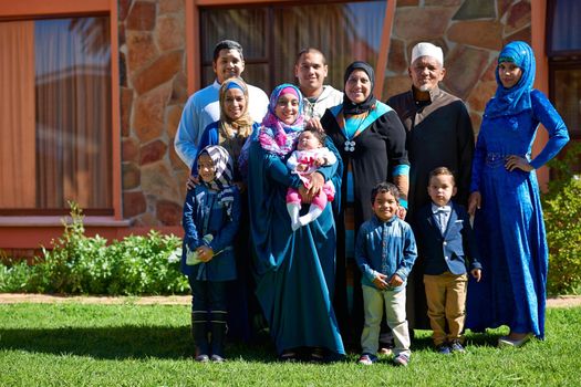 Family first. Portrait of a happy muslim family standing together in front of their house.