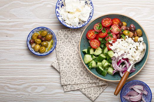 Greek salad with vegetables and feta cheese from above copy space