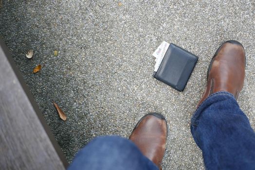 left wallet on floor in the park