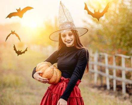 Portrait of teenage girl in witch hat