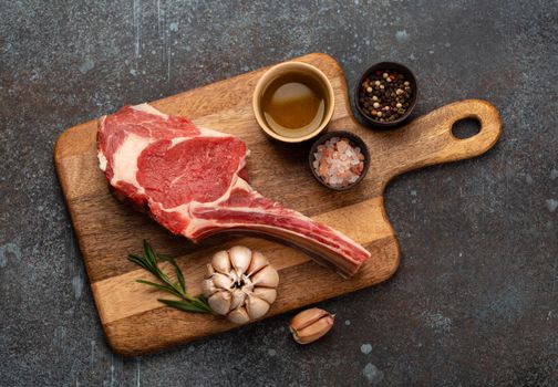 Raw marbled meat steak on wooden board