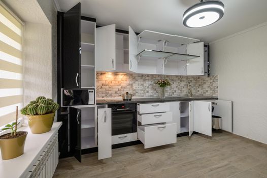 Renovated Interior for modern trendy white kitchen with doors open