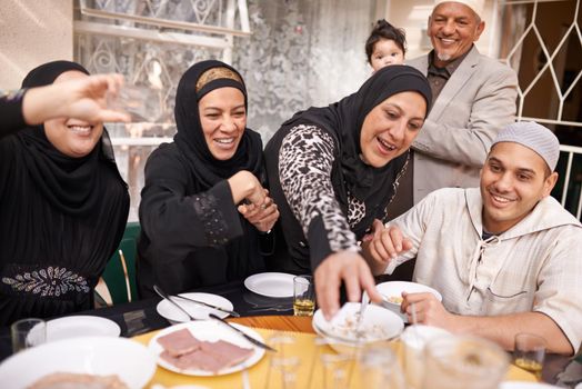 I made enough for everyone. a muslim family eating together.