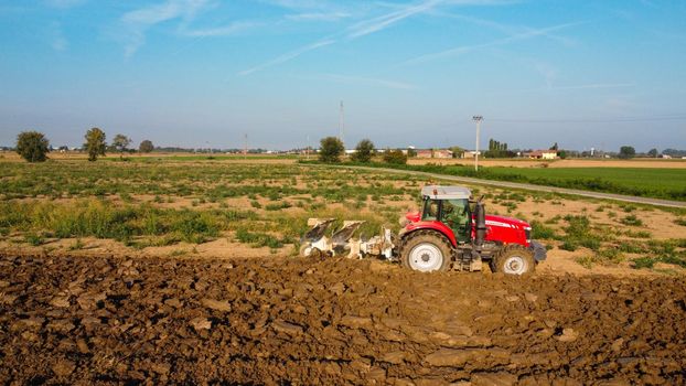 Monitcelli, Italy PC - September 2022 Tractor plowing the land in the fields