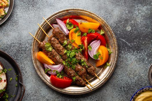 Delicious meat kebab with fresh vegetable salad