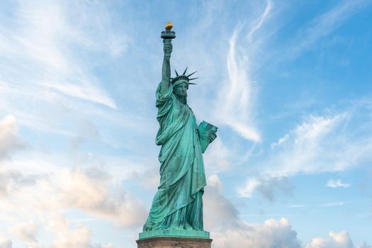 Statue of liberty in New York City, USA with blue sky background