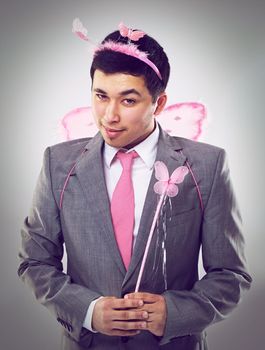 Let me make those business wishes a reality. A cropped shot of a businessman dressed as a fairy.
