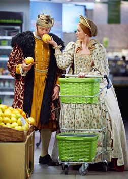 This is why one has servants to do the shopping....A king and queen buying groceries in a groceries store.