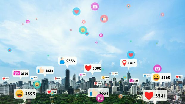Social media icons fly over city downtown showing people reciprocity connection