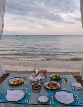 Dinner by candle light on the beach in Thailand