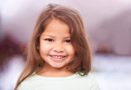 Little girls make the world sweeter. Portrait of a cute little girl with a bright smile.
