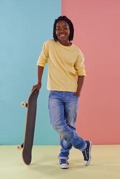 Lets hit the skate park. Studio portrait of a preteen boy holding his skateboard.
