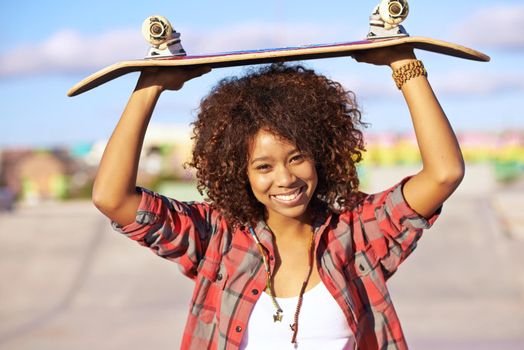 Skateboardings the real winner. a young woman with her skateboard in a skatepark.