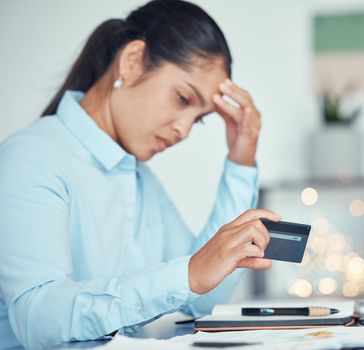 Confused woman and finance debt on credit card for invoice payment in mental panic at desk. Stressed and anxious entrepreneur girl with bankruptcy loan crisis sad about failure of business.