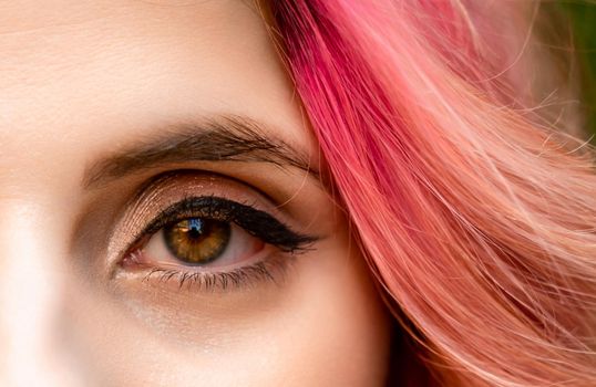 Macro shot of woman's eye with transparent makeup. Expressive look. sight.