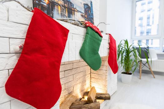 Christmas stocking on fireplace background.