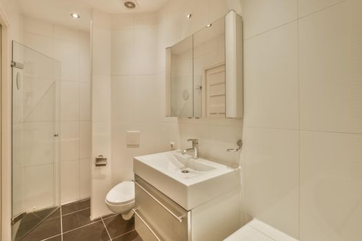 Bathroom with white tiled walls