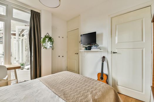 Spacious modern bedroom with panoramic windows