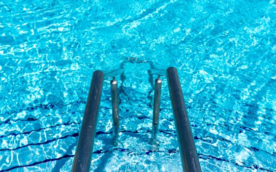Swimming pool steps with clear water surface background, nobody
