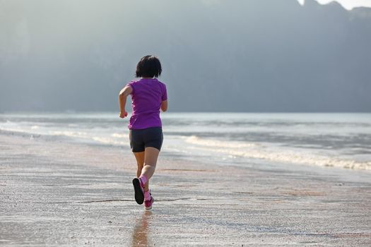 Fitness runner woman on ao nang beach  Krabi  Thailand