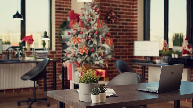 Business office decorated with christmas tree and lights