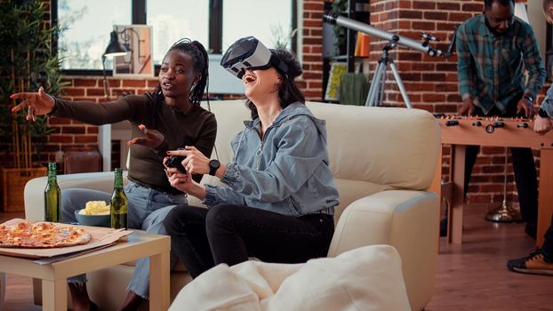 Women playing video games with vr glasses on console