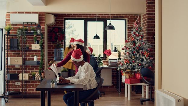 Diverse people working in festive office