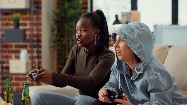 Multiethnic team of women playing video games online