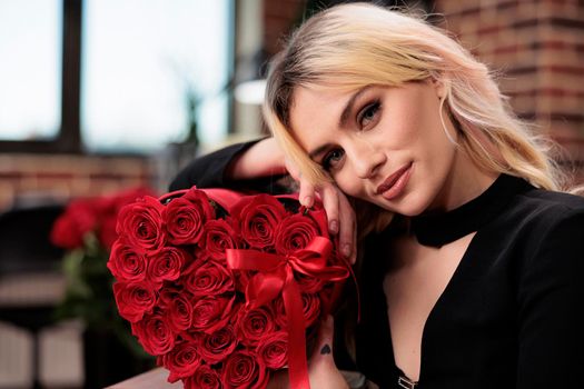 Woman posing with red roses close up portrait