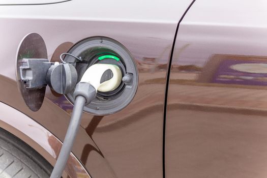 Power supply connect to electric vehicle for charge to the battery.